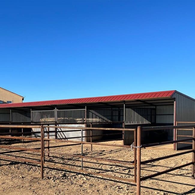 Portable loafing shed with pipe fence runs
