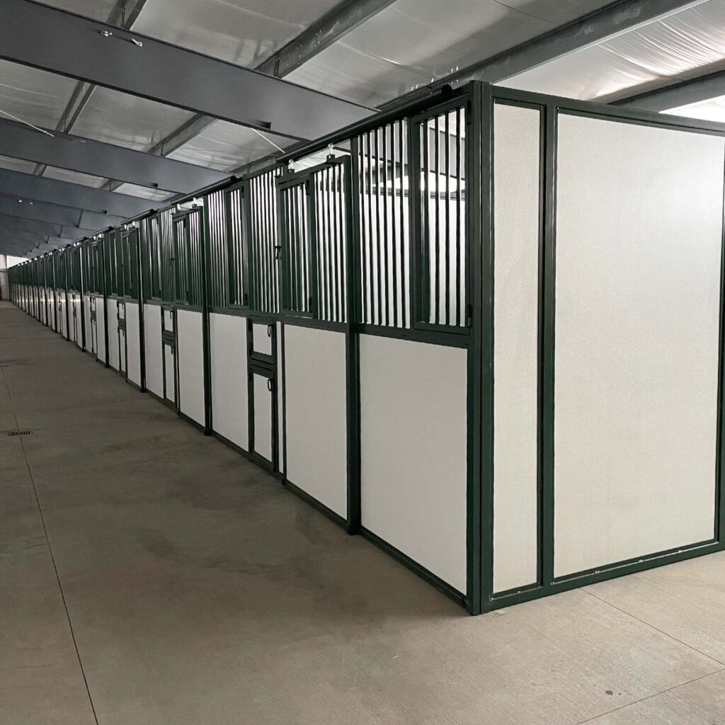custom barn stalls with metal framing and custom stall doors